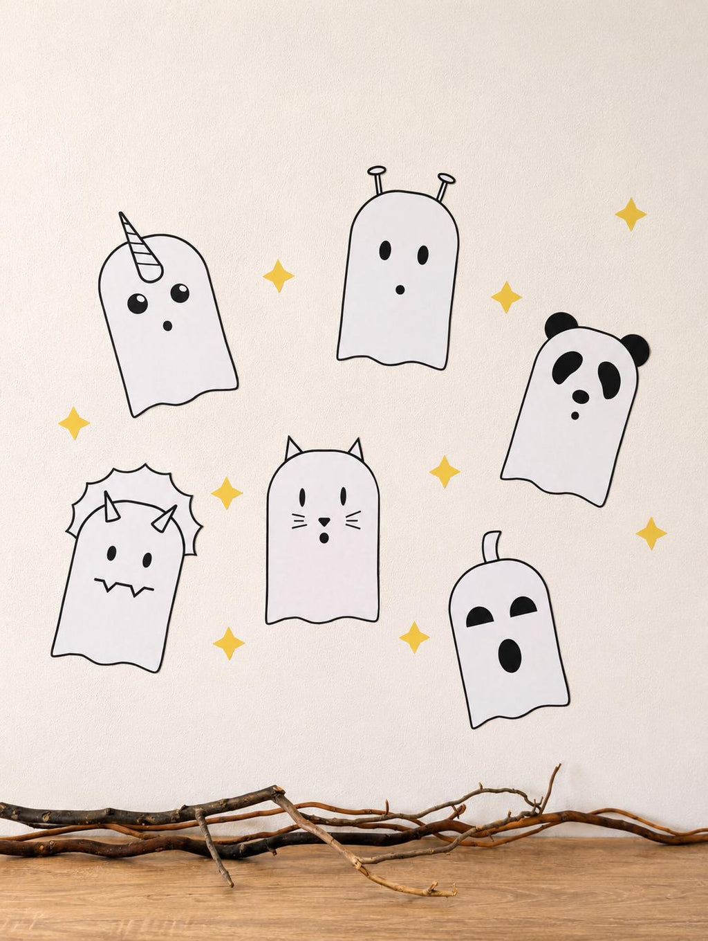 Six cute ghost wall decals on a cream wall