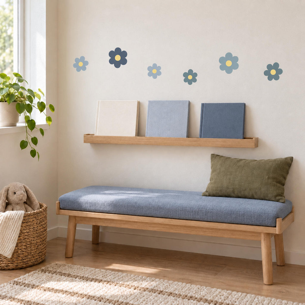 Blue flower wall decals arranged above furniture
