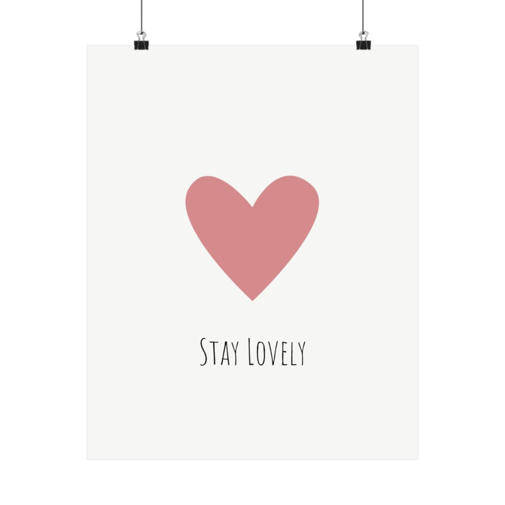 Stay Lovely pink heart poster on a wall