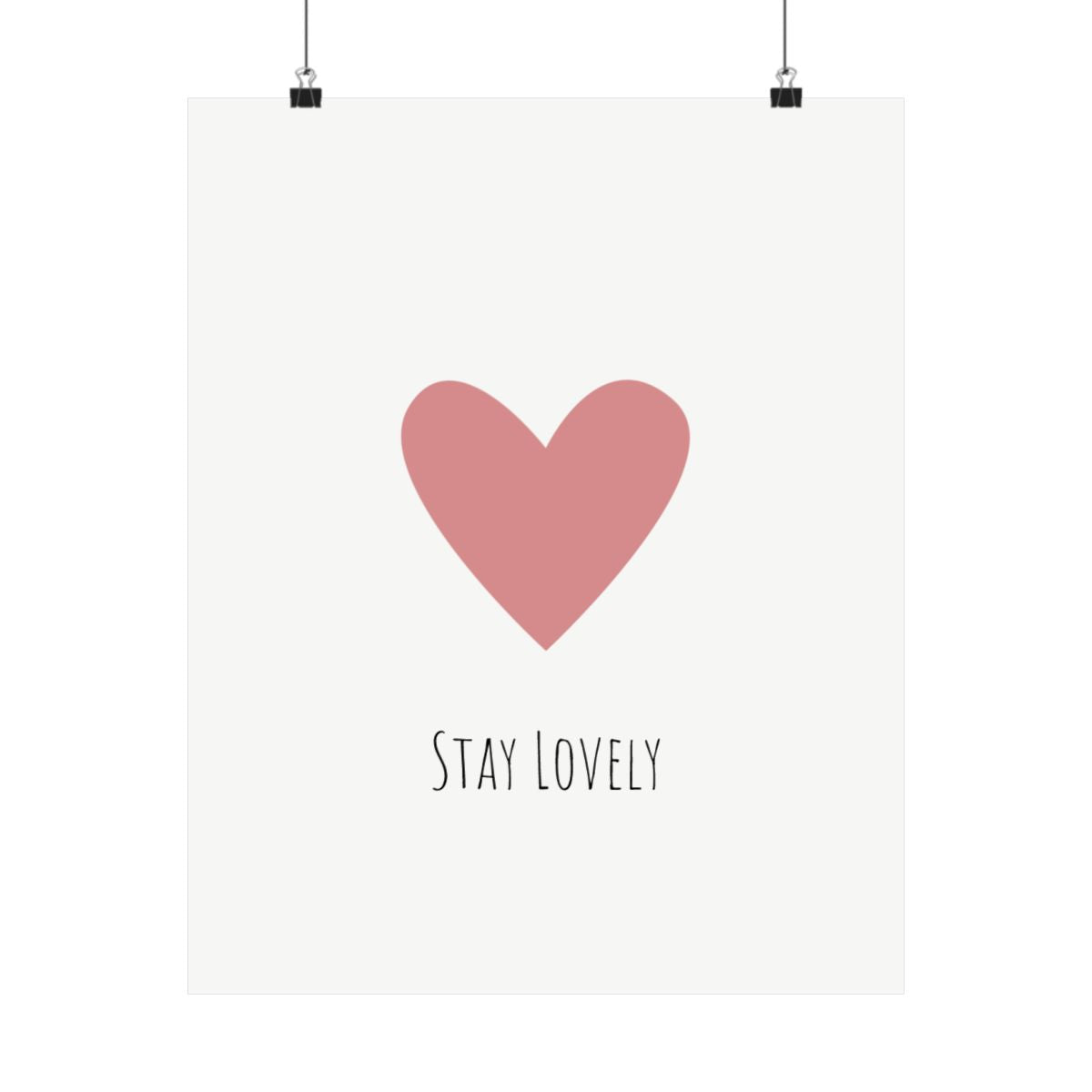 Stay Lovely pink heart poster on a wall